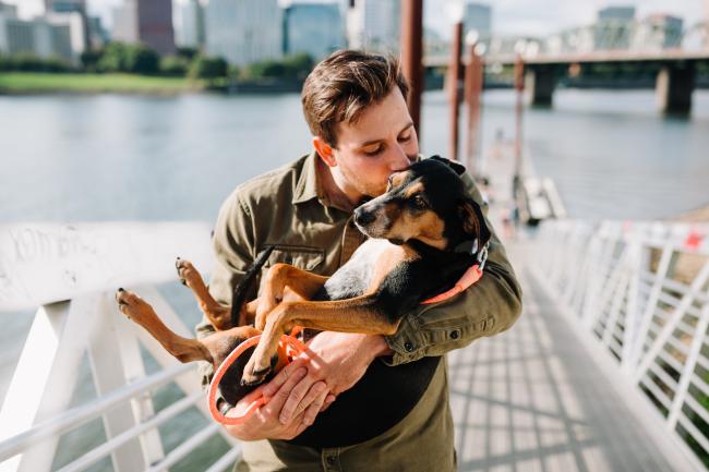 Owner holding dog